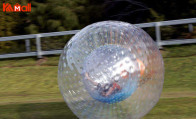 giant clear ball with people inside